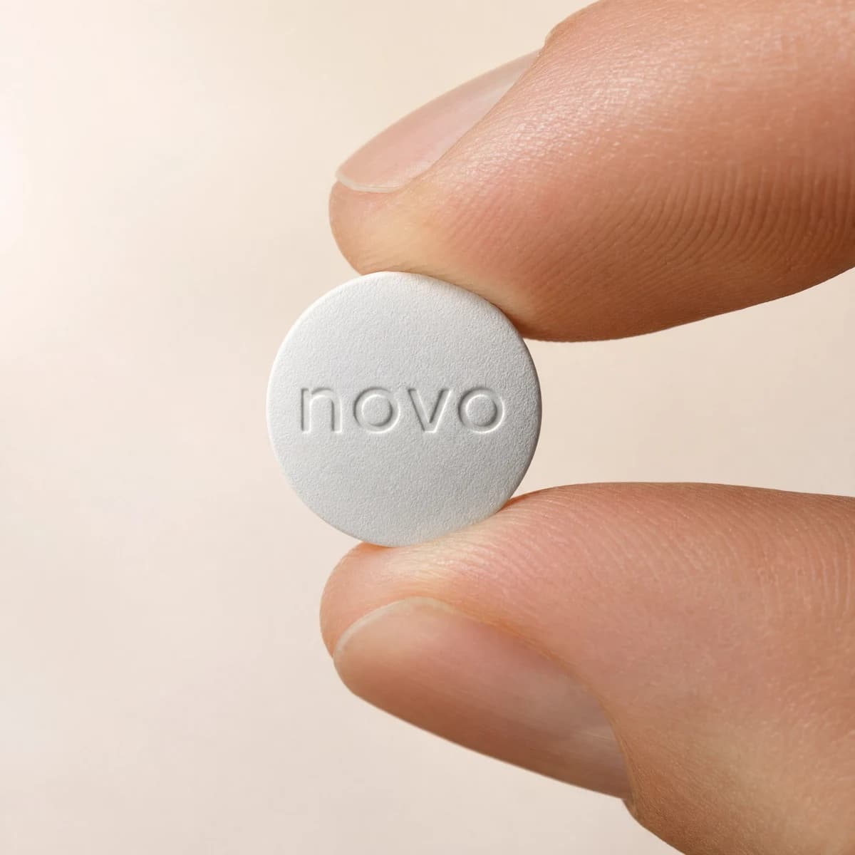 The once daily Wegovy tablet, held between two fingertips