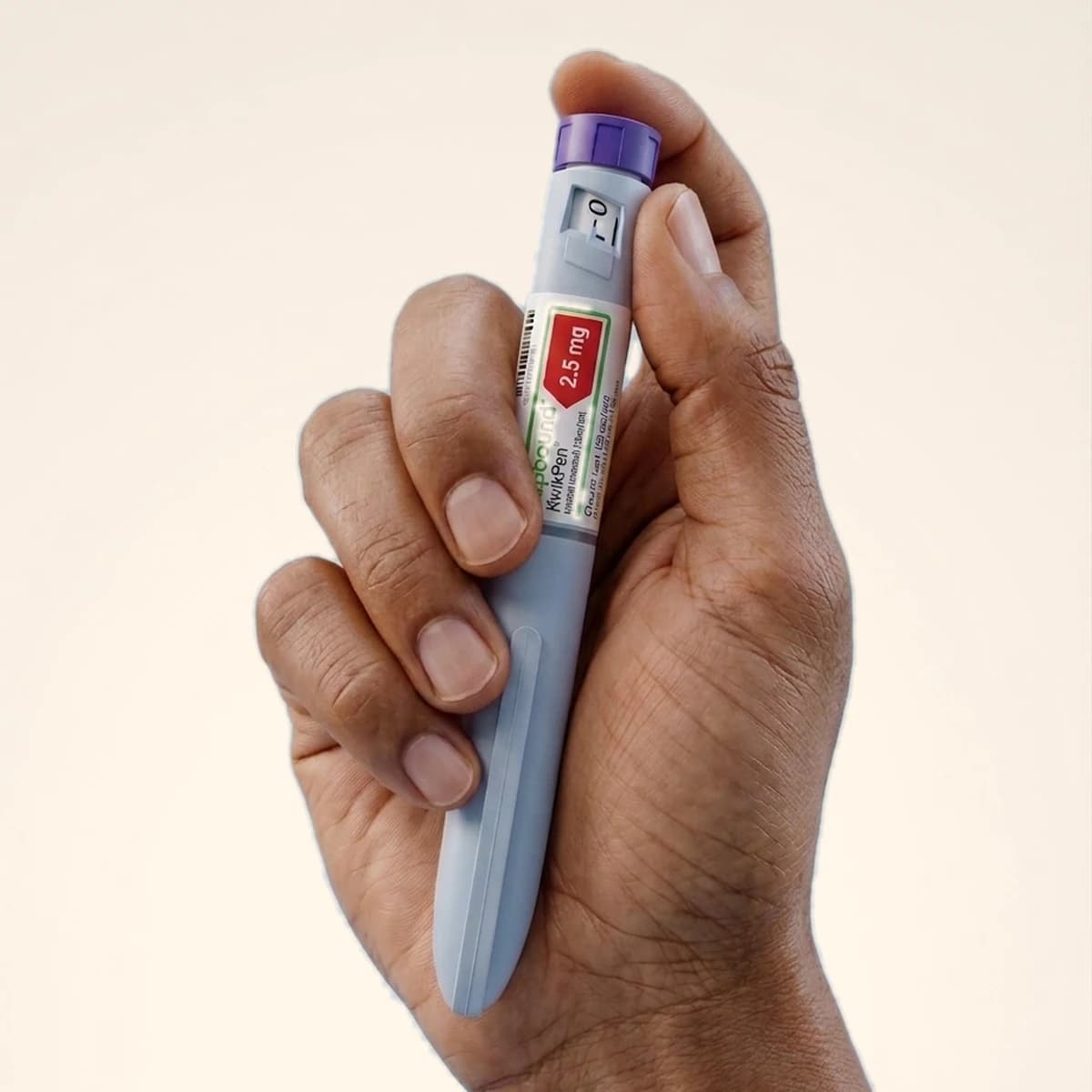 The Zepbound KwikPen, a multi dose injection pen, held in one hand